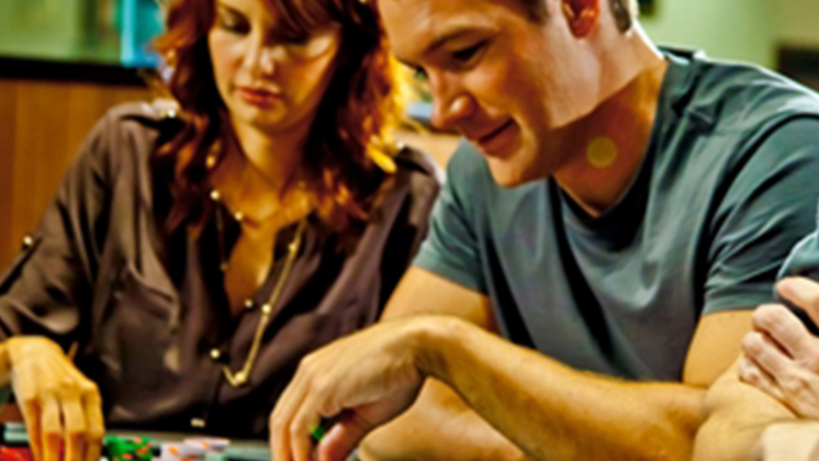 Man and Woman Counting Poker Chips