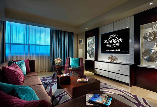 Presidential Suite living area with couch and tv at Seminole Hard Rock Hotel Hollywood