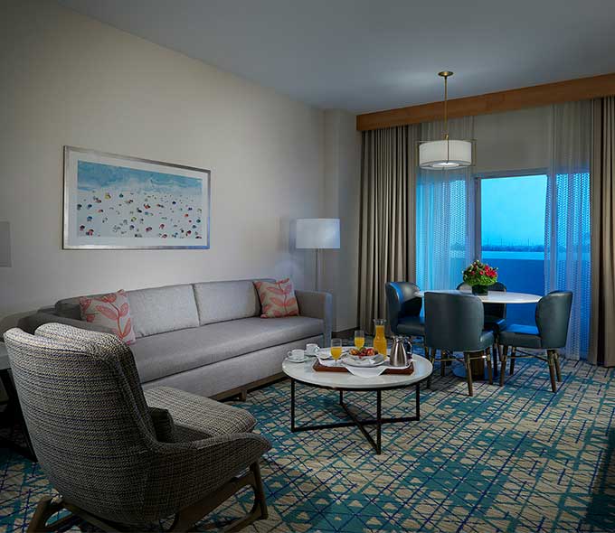 Platinum Suite with a large couch and dining area at Hard Rock Hotel & Casino Hollywood